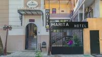 a sign for a mariata hotel on a building at Marita Hotel in Tbilisi City