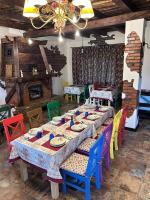a table in a room with colorful tables and chairs at Файно in Beloberëzka