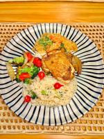 a plate of food with rice and chicken and vegetables at Pousada Divino Milagre in Passo de Camarajibe