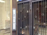 a row of glass doors in a building at Brà Guest House in Verona