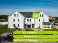 an image of a white house with the words irik fletcherick and her at Pension Sonnengarten &amp; Therme included - auch am An- &amp; Abreisetag! in Lutzmannsburg
