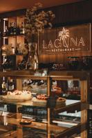 a display window of alaguna restaurant with pizzas at Laguna Beskidów Resort - Apartament Podhalański in Zarzecze