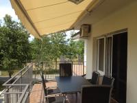 A balcony or terrace at Panorama Sunshine Apartman