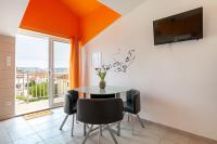 Televízia a/alebo spoločenská miestnosť v ubytovaní Apartments D&A