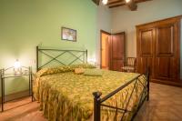 Posteľ alebo postele v izbe v ubytovaní Agriturismo Il Poggetto