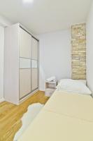 Posteľ alebo postele v izbe v ubytovaní Apartment Domalu Old Town