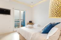 Posteľ alebo postele v izbe v ubytovaní Bluetopia Suites