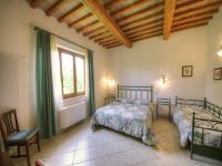Saturnia Pian Di Catavernaにあるベッド
