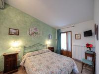 Saturnia Pian Di Catavernaにあるベッド