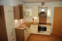 a kitchen with a sink and a stove at Ferienwohnung Kendler in Hüttschlag