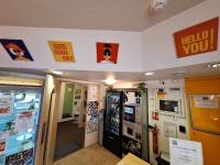 a video game shop with a hello you sign on the wall at ENZO HOTELS GREEN proximité ZENITH D' AUVERGNE Ex F1 FORMULE 1 CLERMONT FERRAND ISSOIRE COUDES in Coudes