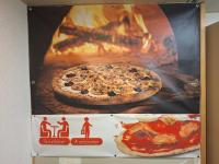 a sign for a pizza oven with a pizza at ENZO HOTELS GREEN proximité ZENITH D' AUVERGNE Ex F1 FORMULE 1 CLERMONT FERRAND ISSOIRE COUDES in Coudes
