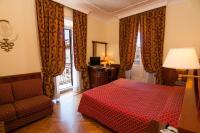 Łóżko lub łóżka w pokoju w obiekcie Hotel Palladium Palace