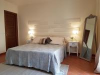 A bed or beds in a room at Il Borgo di San Gervasio