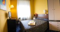 A bed or beds in a room at Hotel Parco Fiera