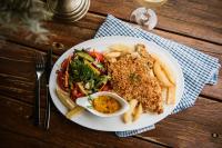 a white plate of food with meat and french fries at Bendemeer Hotel in Bendemeer