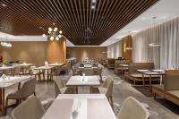 a dining room with tables and chairs and tablesktop at Chengdu Yueming Hotel,2-minute walk to Subway ,close to Kuanzhai Alley and Chunxi Road,Free laundry, Free coffee, Chengdu food,English communication well,Private travel advice in Chengdu