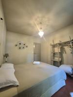 Ein Bett oder Betten in einem Zimmer der Unterkunft Le Mas de Lucas
