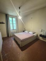Ein Bett oder Betten in einem Zimmer der Unterkunft Le Mas de Lucas