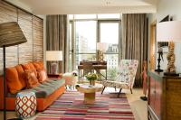 a living room with a couch and a chair at Goralska Résidences Paris Bastille in Paris