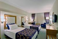 Postel nebo postele na pokoji v ubytování Tugcu Hotel Select