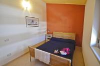 Posteľ alebo postele v izbe v ubytovaní Casa Vacanza Tortolì Plus VIII e IX