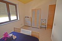 Posteľ alebo postele v izbe v ubytovaní Casa Vacanza Tortolì Plus VIII e IX