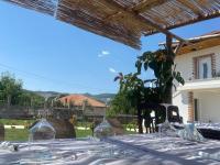 a table with wine glasses on top of it at Mosaic Guesthouse in Lin