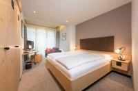 Posteľ alebo postele v izbe v ubytovaní Aktiv Hotel Schweizerhof Kitzbühel