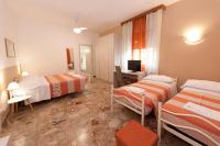 Posteľ alebo postele v izbe v ubytovaní Gardenia Guest House
