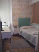 A bed or beds in a room at PR La Paz