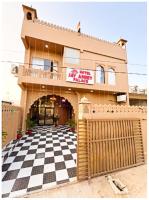 a house with a checkered floor in front of it at Hotel Jay ambey palace In Jaipur in Jaipur