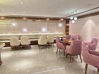 a conference room with chairs and tables and a chalkboard at Orange Hotel Beijing Qianmen Street in Beijing