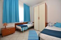 Ein Bett oder Betten in einem Zimmer der Unterkunft Verudela Villas