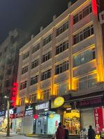a large building on a city street at night at Marmara Suit Hotel in Avcılar