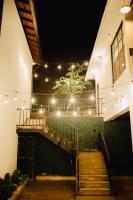 a set of stairs in a building with lights at O'Neill's Cottage in Dikkapitiya