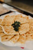 a pile of tortilla chips on a white plate at O'Neill's Cottage in Dikkapitiya