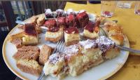 a plate of food with a plate of desserts on a table at Al Giardino Toscano in Montecarelli