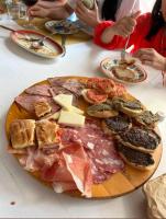 a plate of food with meat and other foods on a table at Al Giardino Toscano in Montecarelli