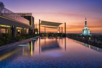 a pool with a view of the eiffel tower at AC Hotel by Marriott Santiago de los Caballeros in Santiago de los Caballeros