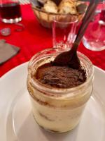 Un postre en un frasco con una cuchara dentro. en Ci Thorno Hotel, en Crosia