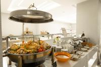 a kitchen with a large pot of food on a counter at MADEN Al Rawda مادن الروضة in Al Madinah