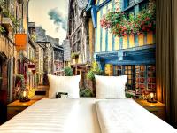 a large white bed in the middle of a street at Designhotel Central Fulda in Fulda