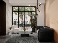 a living room with a couch and a coffee table at Bob W Munich Old Town in Munich