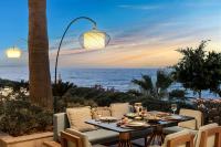 a dining table with a view of the ocean at Swissôtel Living Bodrum in Bodrum City