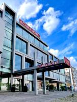 a building with a sign for a hospital at Aspire AcarA Oldenburg, Trademark Collection by Wyndham in Oldenburg