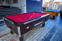 una mesa de billar con un paño rojo encima en Always Inn Lounge & Hotel, en Lekki