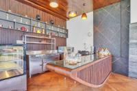 a kitchen with a counter with glasses on it at SILA - Mountain Majesty in Sakleshpur