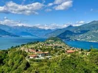 a town on a hill next to a body of water at Hotel Il Perlo in Bellagio
