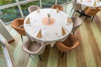 a white dining room table with chairs at Hotel Jezero in Bohinj